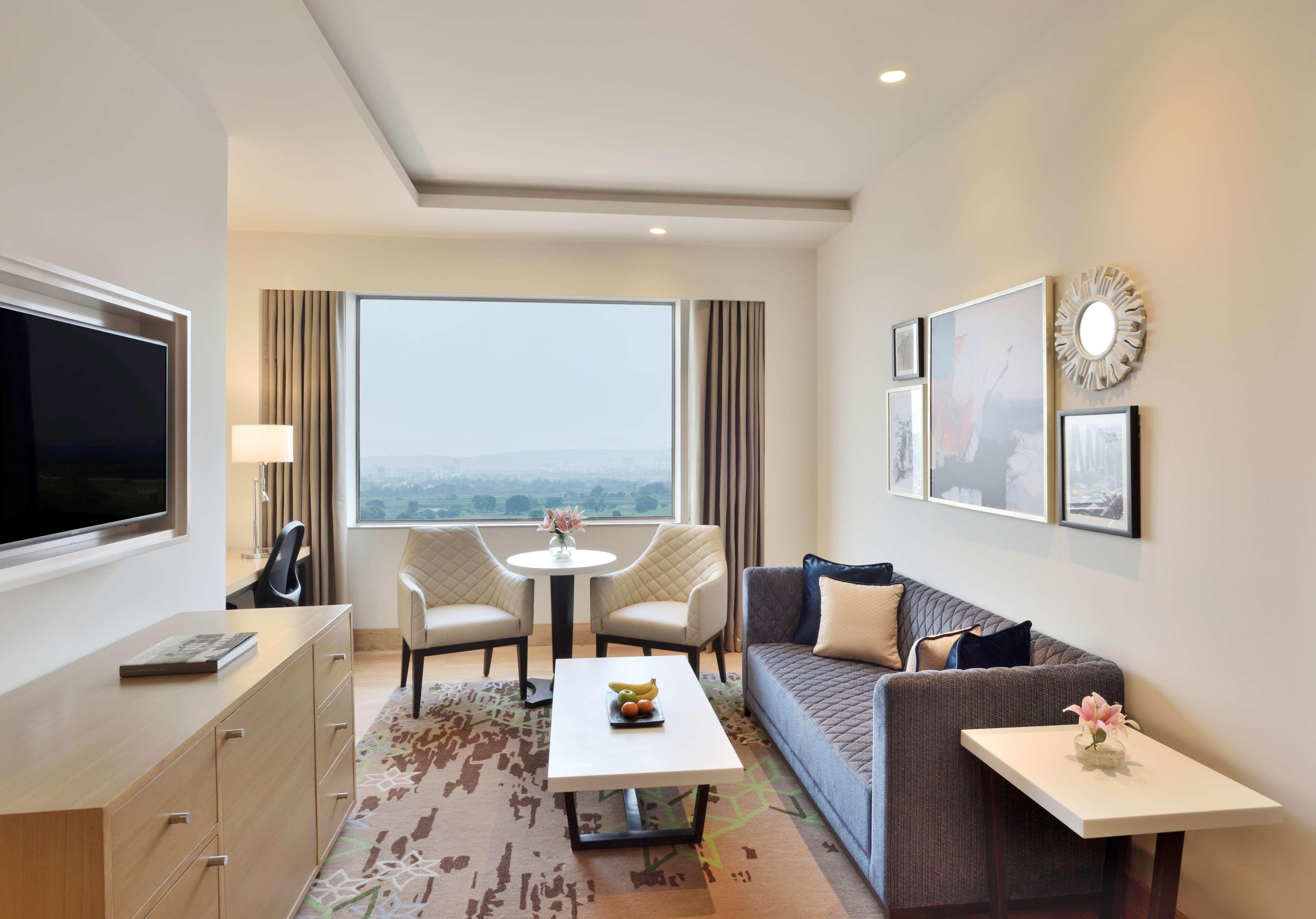Radisson Gurugram Udyog Vihar Hotel Gurgaon Buitenkant foto Living room of a suite